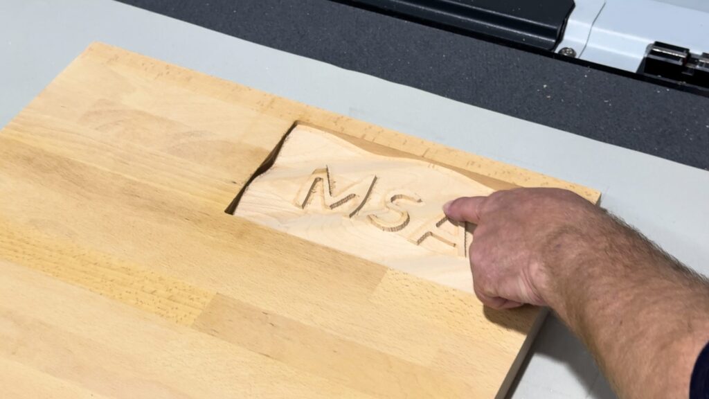 Detail of the 3D-milled freeform surface with lettering